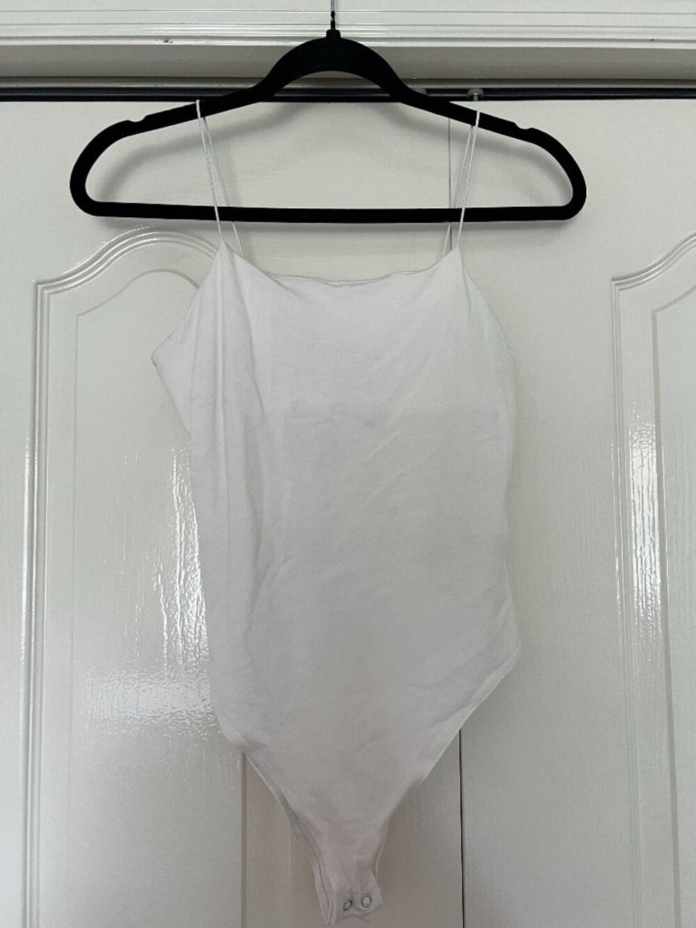 White body suit with thin straps
